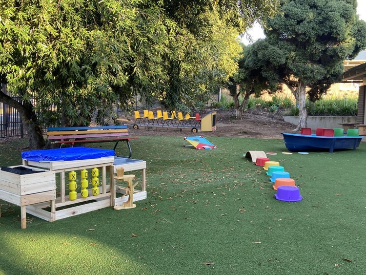 A picture of our Sensory area showcasing the handmade boat, bus, and other tactile resources.