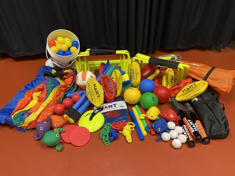 A photo of the pile of sports equipment and challenge games purchsed with the grant.