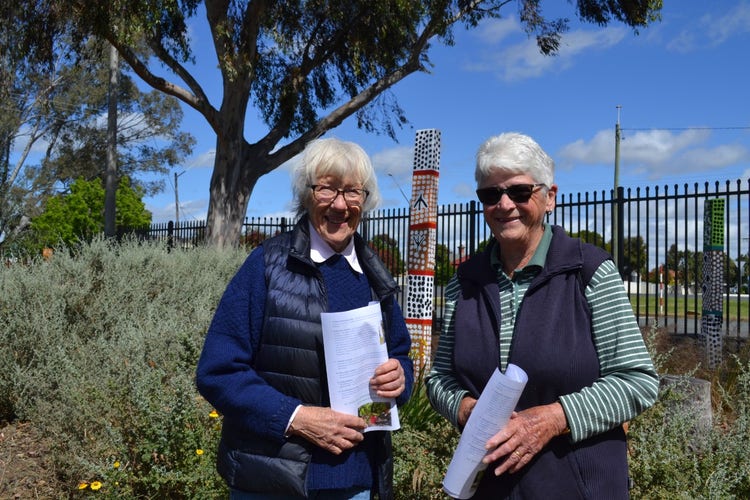 2 ladies enjoying a walk through our Yindyamarra garden, stopped to smile at the camera.